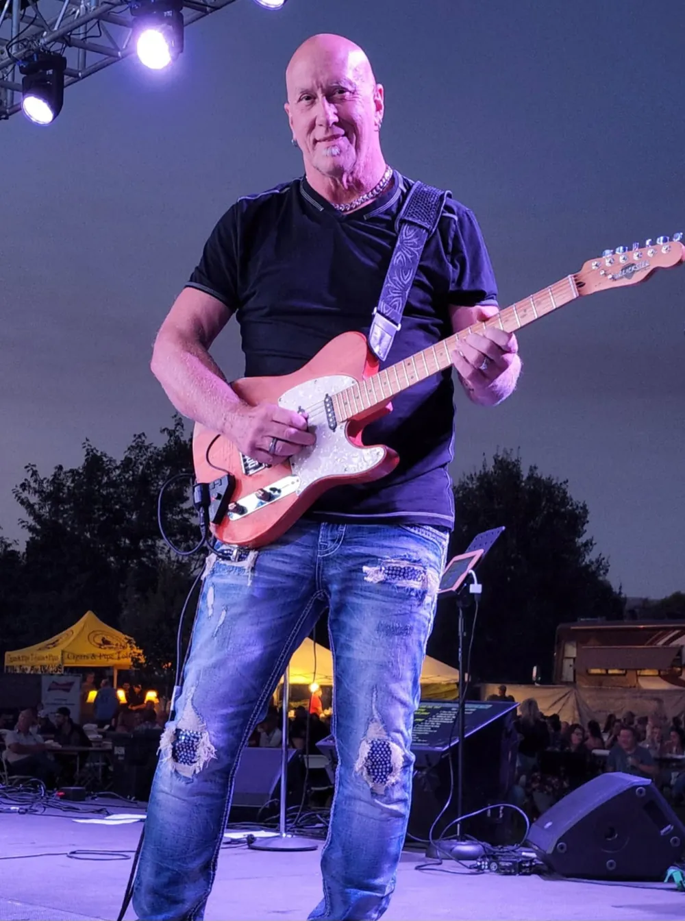 Ron Mears on stage at night